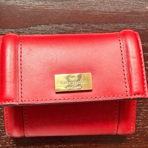 kate spade red leather trifold wallet with gold plaque